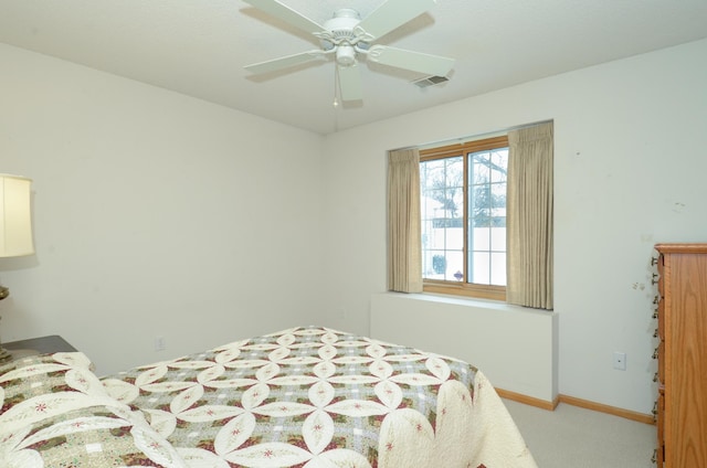 bedroom featuring ceiling fan and light carpet