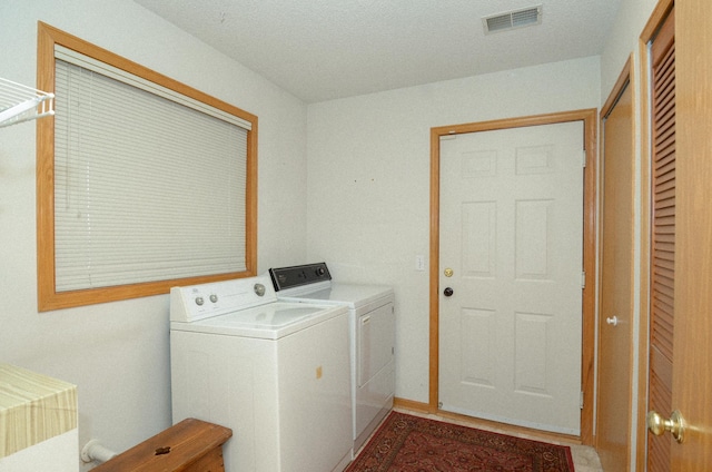 laundry room featuring washing machine and clothes dryer