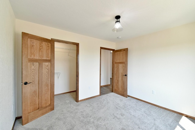 unfurnished bedroom featuring a closet and carpet