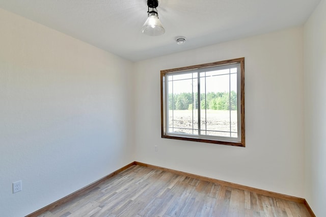 empty room with light hardwood / wood-style floors