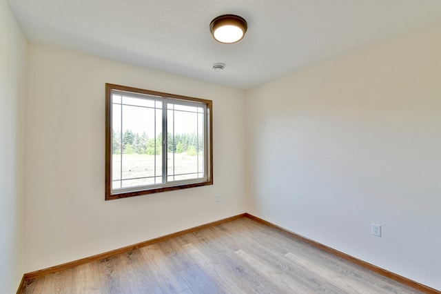 unfurnished room with light hardwood / wood-style flooring