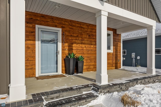 doorway to property featuring covered porch