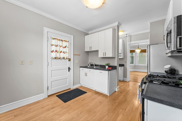 kitchen featuring light hardwood / wood-style floors, sink, white cabinetry, and stainless steel appliances