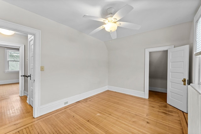 unfurnished bedroom with a closet, ceiling fan, and light hardwood / wood-style flooring