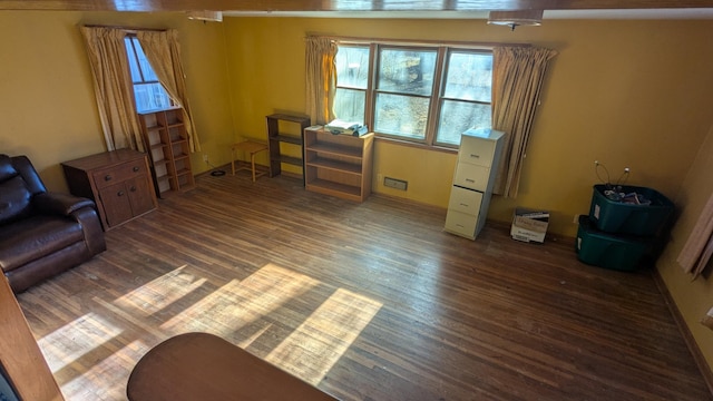 sitting room with dark hardwood / wood-style flooring