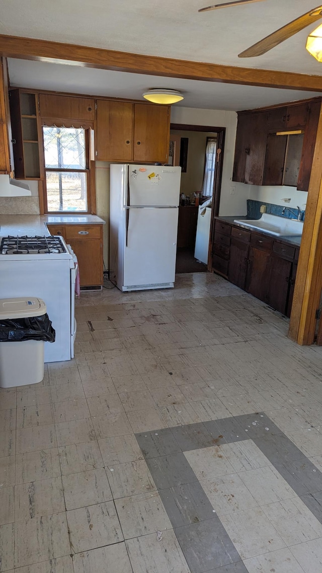 kitchen featuring ceiling fan and white appliances