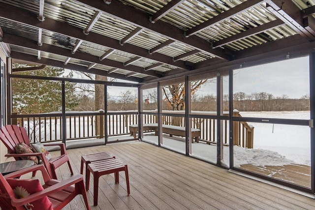 sunroom / solarium featuring a healthy amount of sunlight