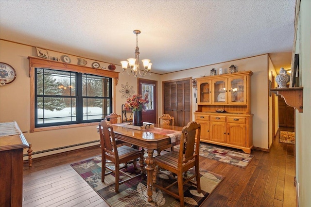 dining space with a baseboard radiator, a textured ceiling, a notable chandelier, and dark hardwood / wood-style flooring