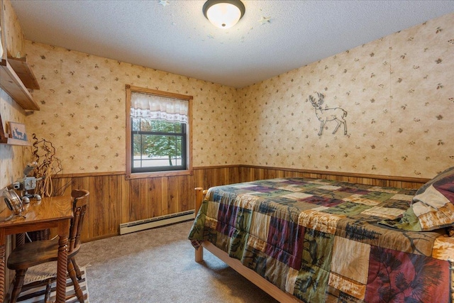 bedroom featuring light carpet, a baseboard radiator, and a textured ceiling