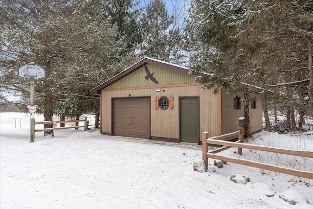 view of snow covered garage