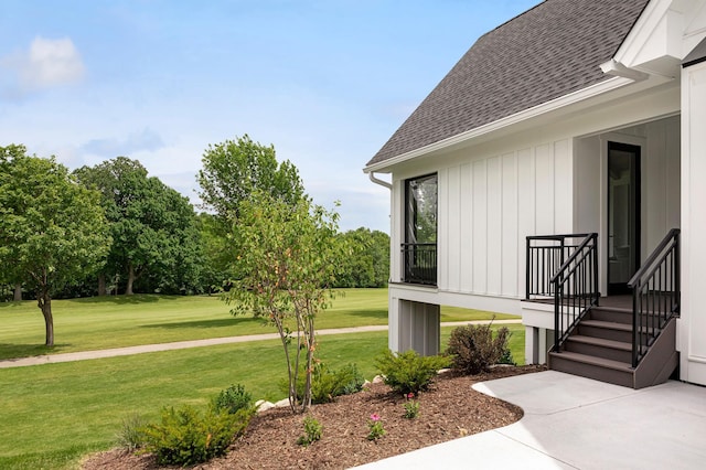 property entrance with a yard