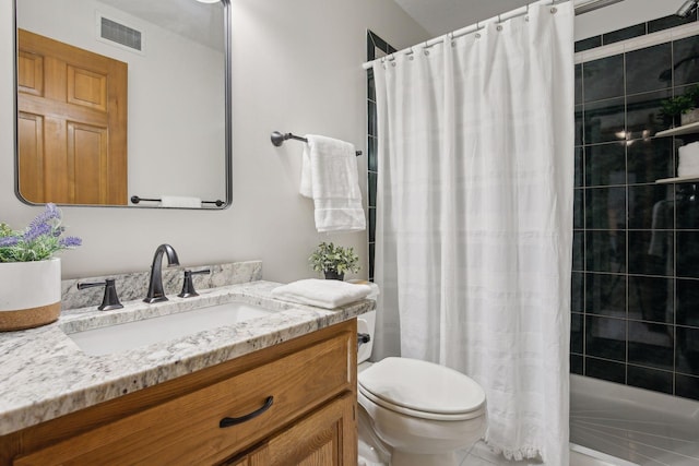 bathroom featuring walk in shower, vanity, and toilet