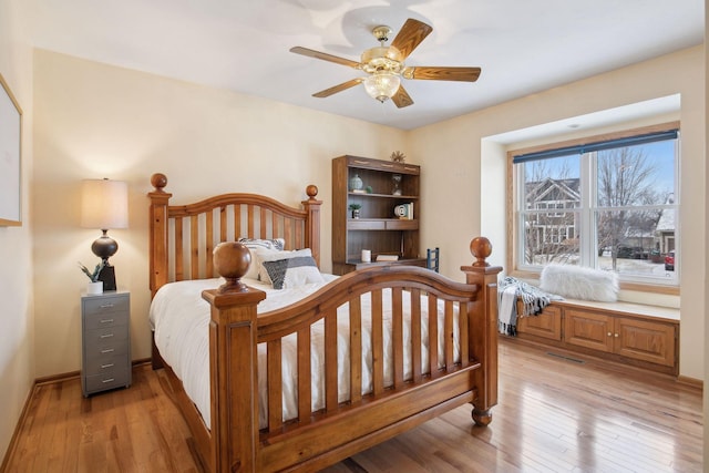 bedroom featuring light hardwood / wood-style flooring and ceiling fan