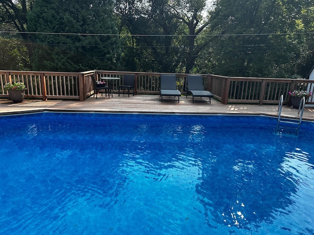 view of pool with a wooden deck