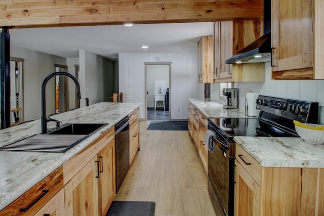 kitchen featuring light wood-type flooring, black appliances, light brown cabinets, a sink, and exhaust hood