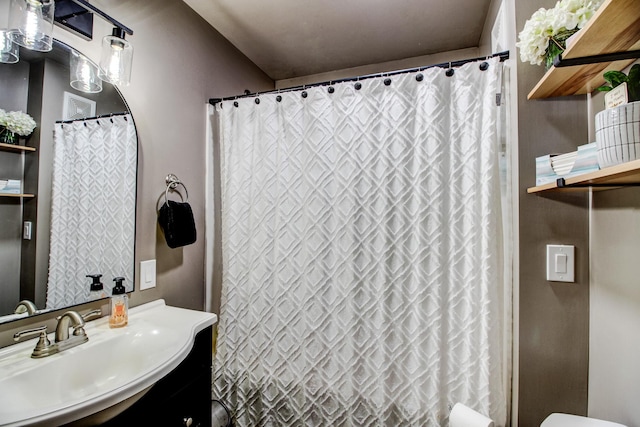 full bathroom featuring vanity and toilet