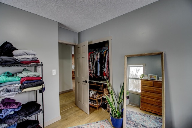 walk in closet featuring light wood-type flooring