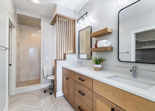 bathroom featuring a shower and vanity