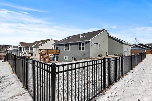 view of snow covered house