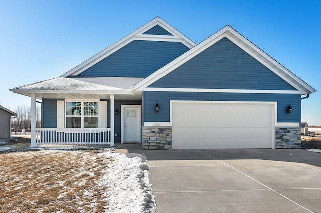 view of front of property with a garage and covered porch