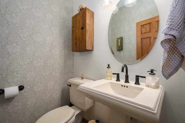 bathroom with sink and toilet