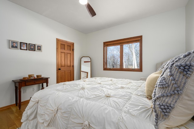 bedroom with ceiling fan and light wood-type flooring