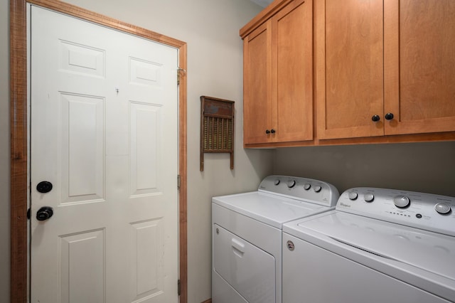 laundry area featuring cabinets and washer and dryer