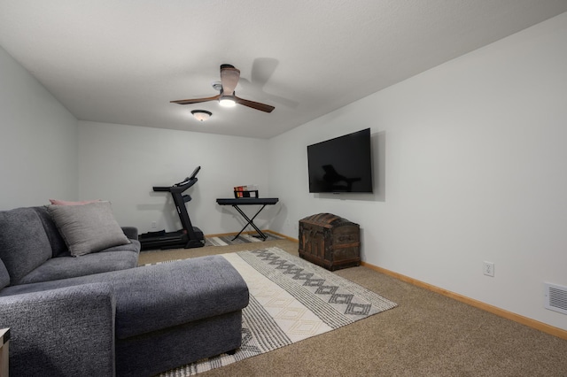 living room with light colored carpet and ceiling fan