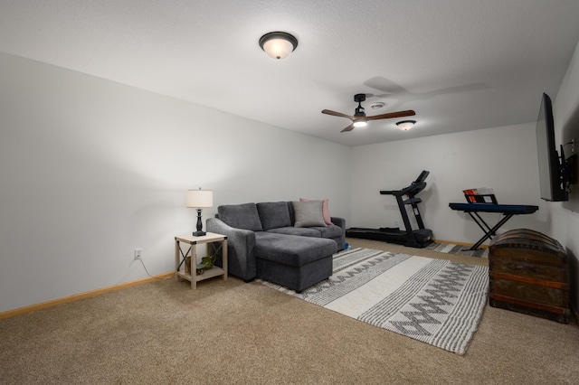 carpeted living room with ceiling fan