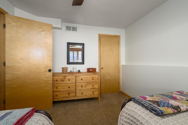 bedroom with dark carpet and ceiling fan