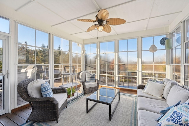 sunroom / solarium featuring ceiling fan