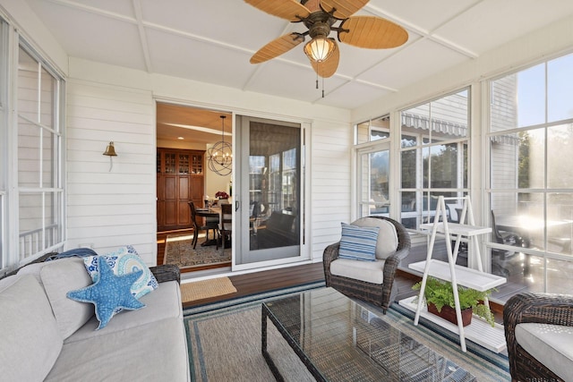 sunroom featuring ceiling fan and coffered ceiling