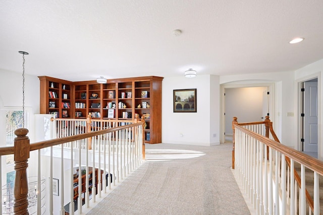 hallway with light carpet