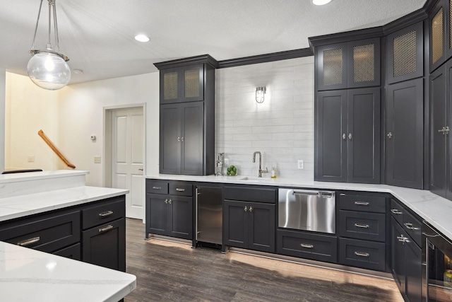 kitchen with wine cooler, stainless steel dishwasher, sink, hanging light fixtures, and dark wood-type flooring