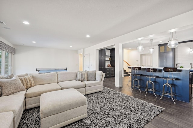 living room featuring dark wood-type flooring