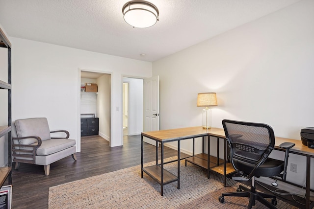 office space featuring a textured ceiling and dark hardwood / wood-style floors