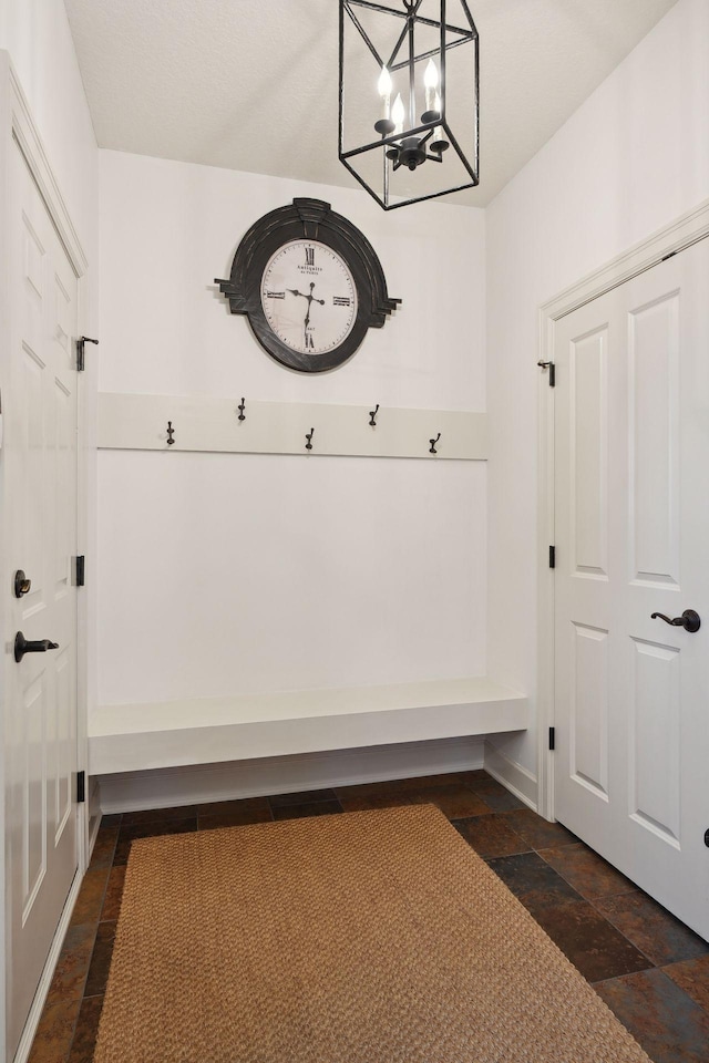 mudroom with an inviting chandelier