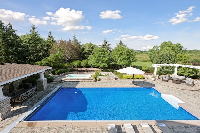 view of swimming pool featuring an in ground hot tub, an outdoor hangout area, a bar, a pergola, and a patio