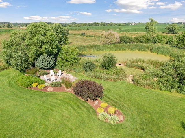 birds eye view of property with a rural view