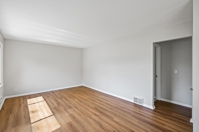 empty room featuring hardwood / wood-style flooring