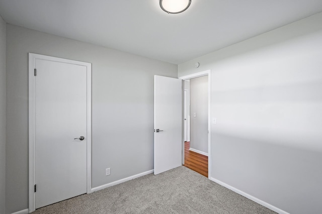 unfurnished bedroom with carpet