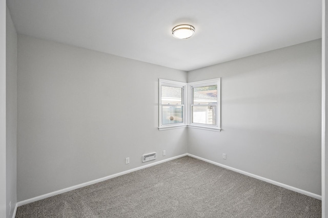 spare room featuring carpet floors