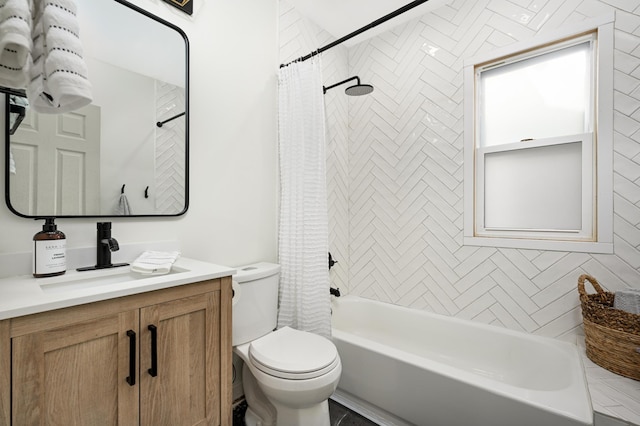 full bathroom featuring vanity, toilet, and shower / tub combo