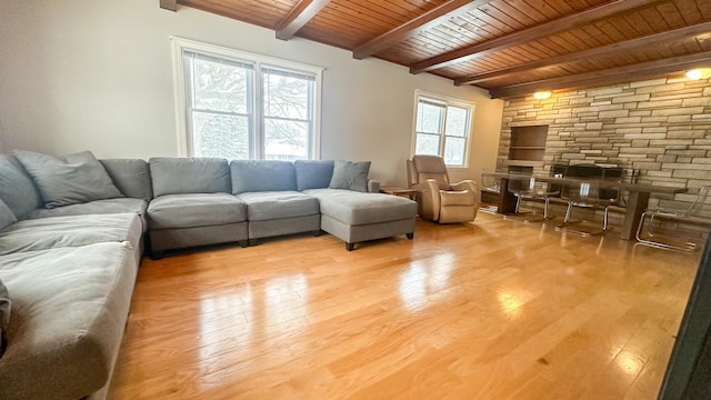 living area with wooden ceiling, beamed ceiling, and light wood-type flooring