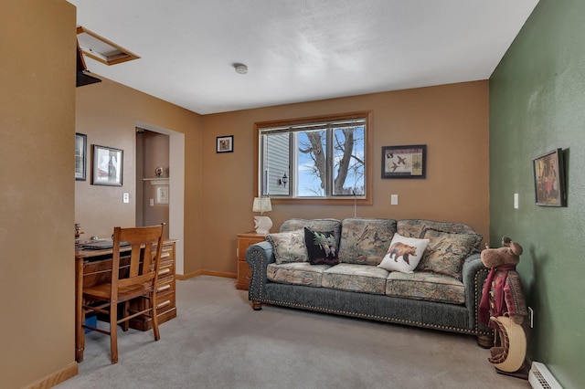 carpeted living room with a baseboard heating unit