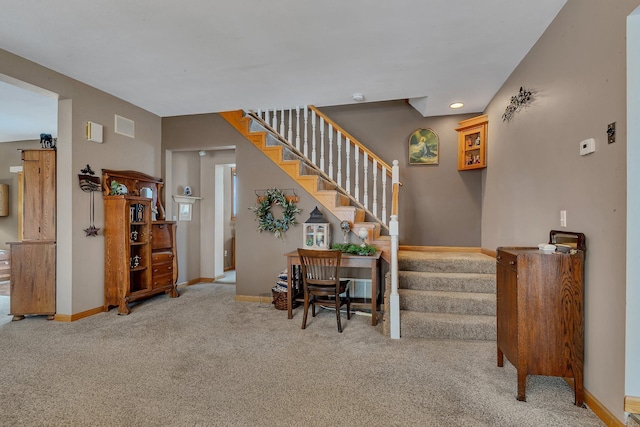 stairway featuring carpet flooring