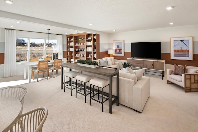 carpeted living room with a textured ceiling