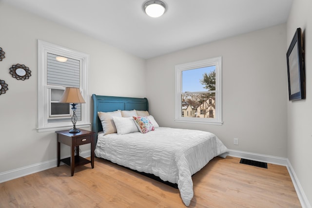 bedroom featuring light hardwood / wood-style flooring