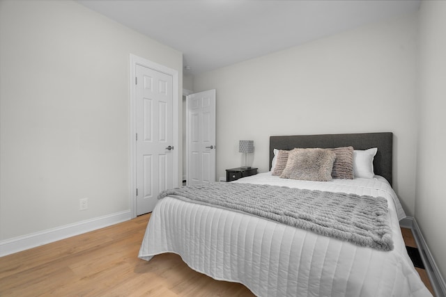 bedroom with hardwood / wood-style flooring