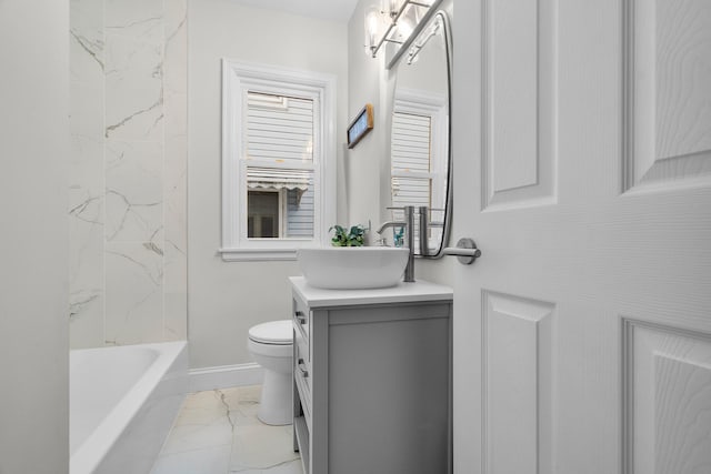 full bathroom featuring tub / shower combination, toilet, and vanity